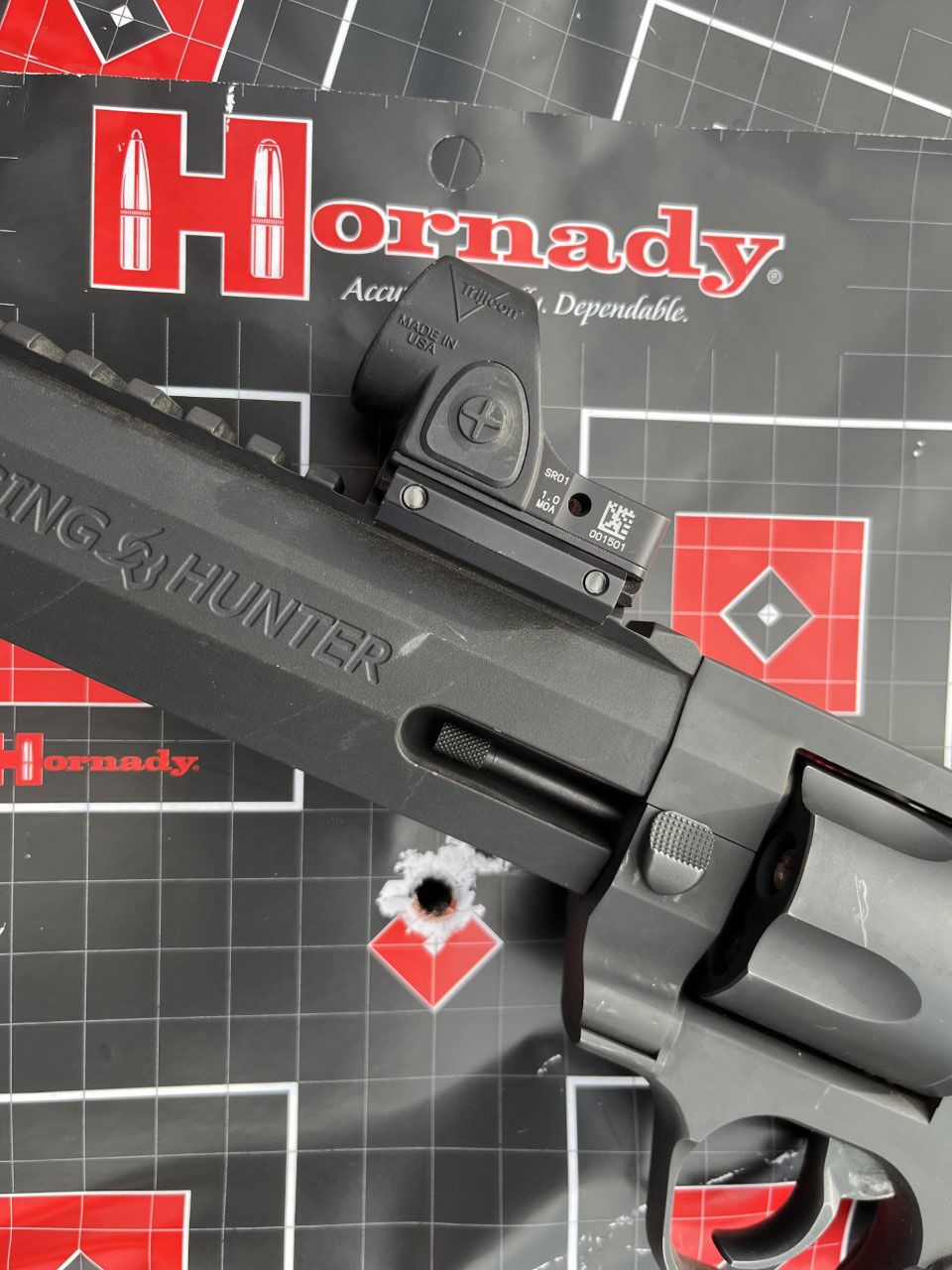 After numerous rounds Larry put his Raging Hunter .454 Casull topped with Trijicon's SRO red dot sight and shooting Hornady 240-grain XTP MAG ammo..when he returned he fired one shot at 100 yards to be sure it was still sighted in...it was!